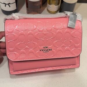 Klare Crossbody in signature patent leather